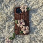 handmade crochet phone case with floral decoration