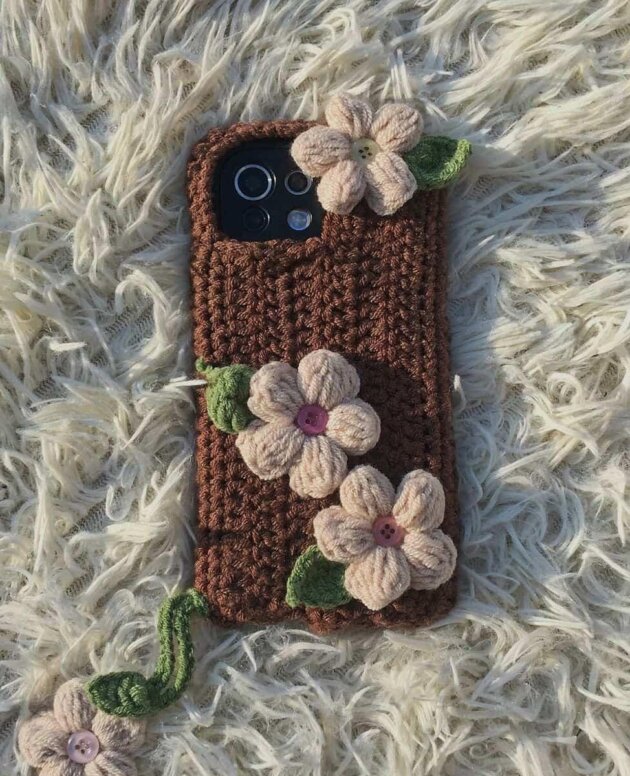handmade crochet phone case with floral decoration